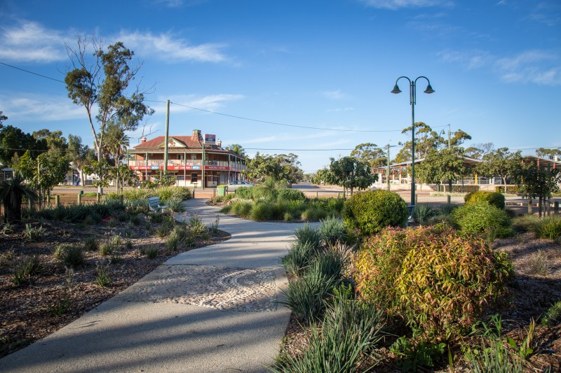 Photo of pebble mosaic inserts decorate the concrete paths in Moora